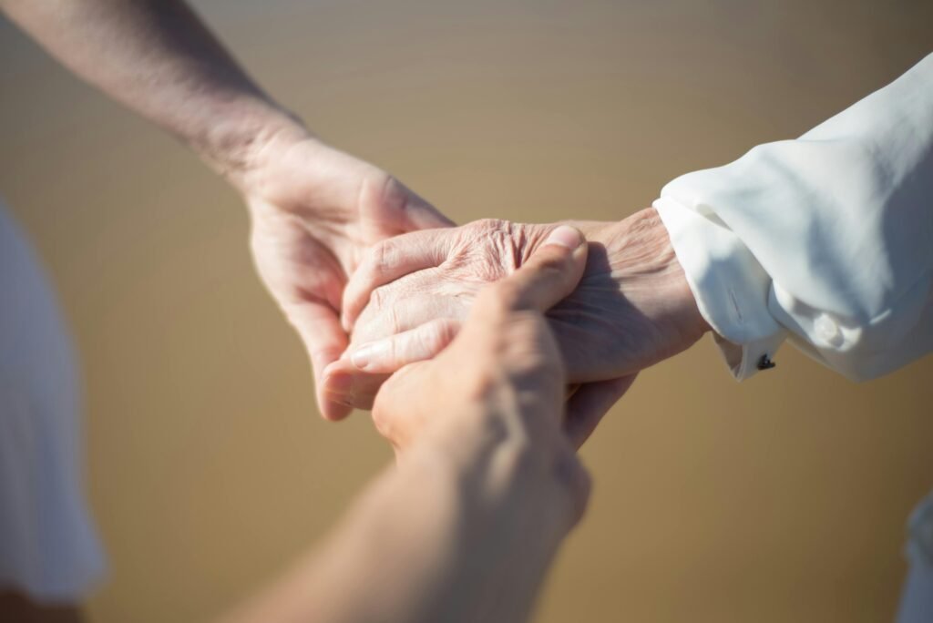 pexels photo 8829175 8829175 Gentle close-up of intergenerational hands holding, symbolizing connection and care.